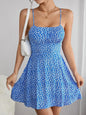 The cami dress with small flower prints a backless design and thin spaghetti straps is suitable for beach vacations and summer